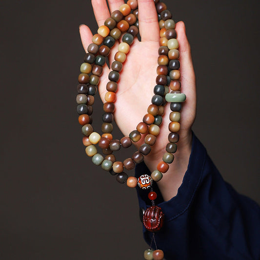 108 bead bodhi seed mala necklace bracelet from Fortune & Karma, shown coiled on a light background
