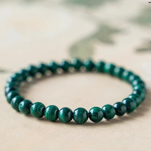 Natural malachite bead bracelet with banded green patterns