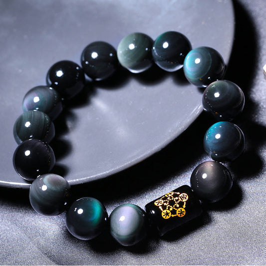 Natural rainbow obsidian beaded bracelet on a soft neutral background, representing renewal after a bracelet breaks