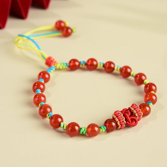 Red Agate Vitality Knot Bracelet with deep red agate beads and a hand-braided knot