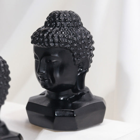 Hand-polished black obsidian Buddha head ornament symbolizing serenity and mindfulness
