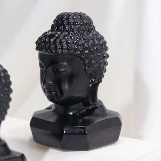 Hand-polished black obsidian Buddha head ornament symbolizing serenity and mindfulness