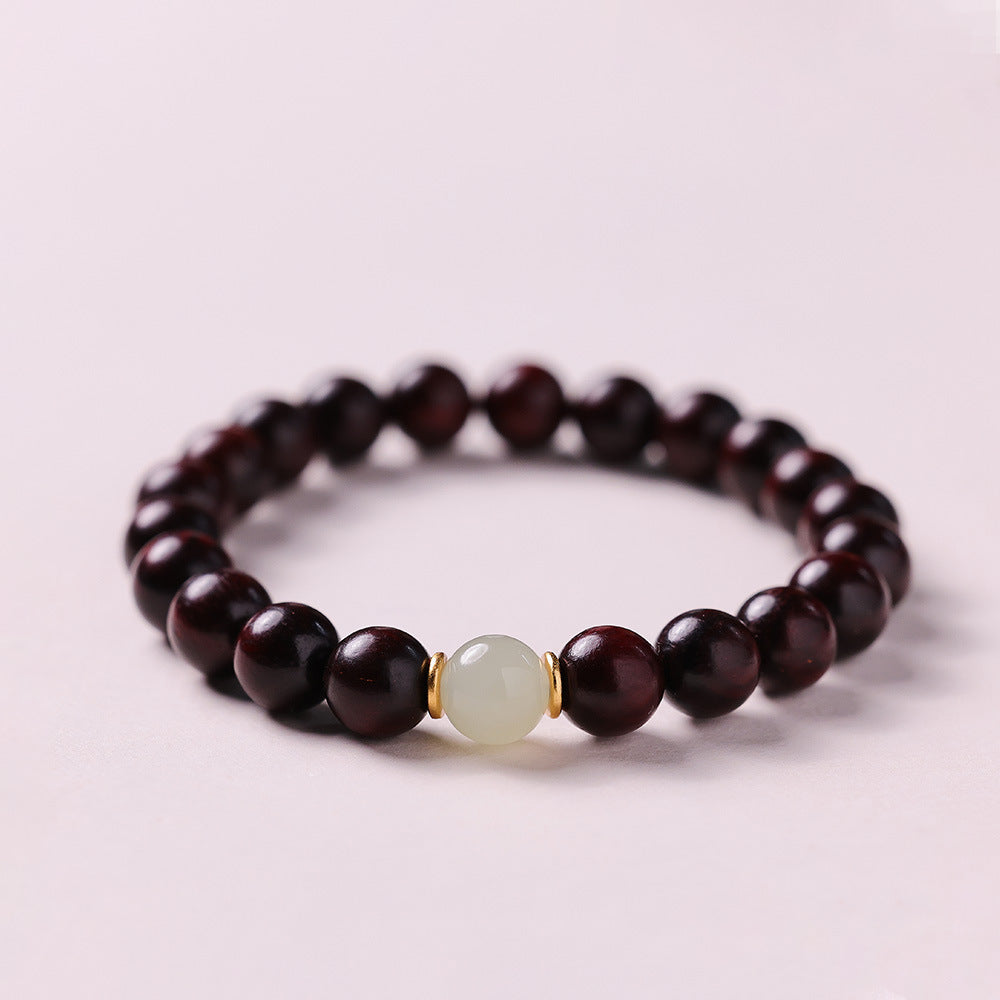 Small leaf red sandalwood bead bracelet with jade accent from Fortune & Karma